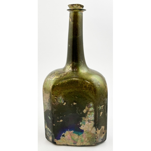 58 - ENGLISH OCTAGONAL WINE BOTTLE. 9.6ins tall, black/ dark green glass beneath quite sensational, highl... 