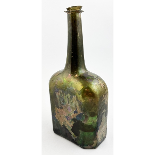 58 - ENGLISH OCTAGONAL WINE BOTTLE. 9.6ins tall, black/ dark green glass beneath quite sensational, highl... 