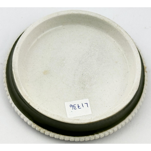 64 - CREAM OF ALMONDS POT LID. (APL p379, 19d) 3.7ins diam. As previous lid but this a dark green backgro... 