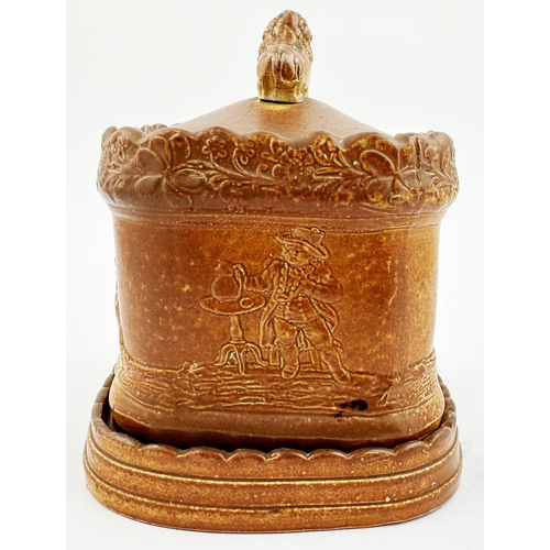 101 - BRAMPTON DATED TOBACCO JAR. 5.5ins tall. Square body, lion atop lid, separate base/ stand. Very vari... 