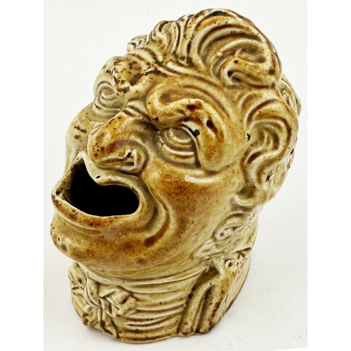 134 - FIGURAL SALT GLAZE INKWELL. 2.9ins tall. Highly varied salt glaze figural head form, wonderfully det... 