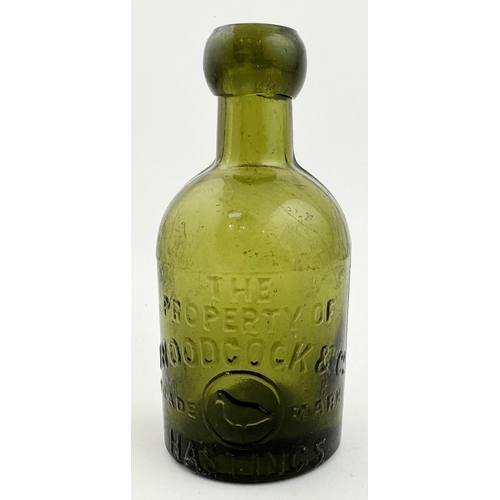 157 - WOODCOCK & CO HASTINGS SELTZER BOTTLE. 5.4ins tall, chunky blob cork closure lip, yellow green glass... 