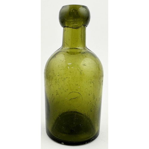 157 - WOODCOCK & CO HASTINGS SELTZER BOTTLE. 5.4ins tall, chunky blob cork closure lip, yellow green glass... 