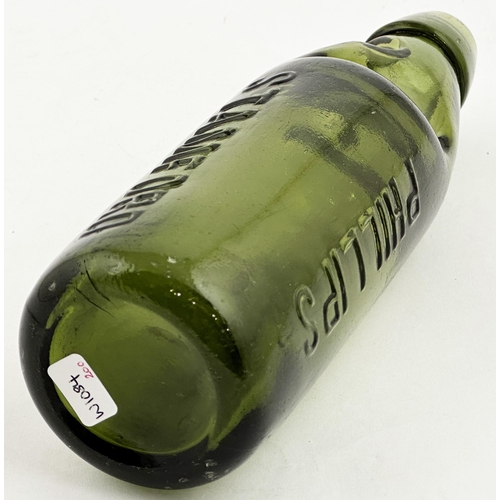 158 - PHILLIPS STAMFORD CODD BOTTLE. 9ins tall, dark green glass, standard two lugs. Heavily embossed vert... 