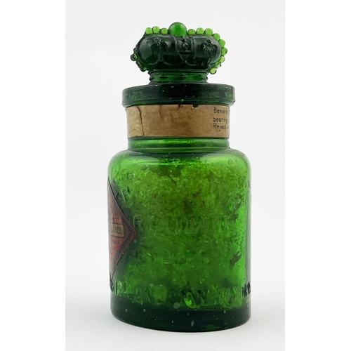 306 - CROWN PERFUMERY COMPANY LABELLED BOTTLE. 4ins tall. Emerald green glass, paper label, crown stopper,... 