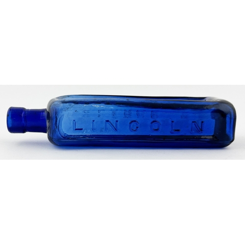 615 - LINCOLN BLOOD MIXTURE BOTTLE. 7.5ins tall. Cobalt blue glass. Embossed to 3 sides. CLARKES. Burst ai... 