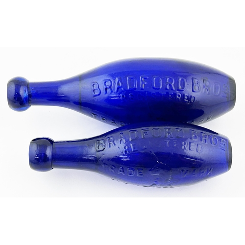 619 - NEWCASTLE FLAT BOTTOMED HAMILTON DUO. Tallest 9ins. Cobalt blue glass, heavily embossing to both. BR... 