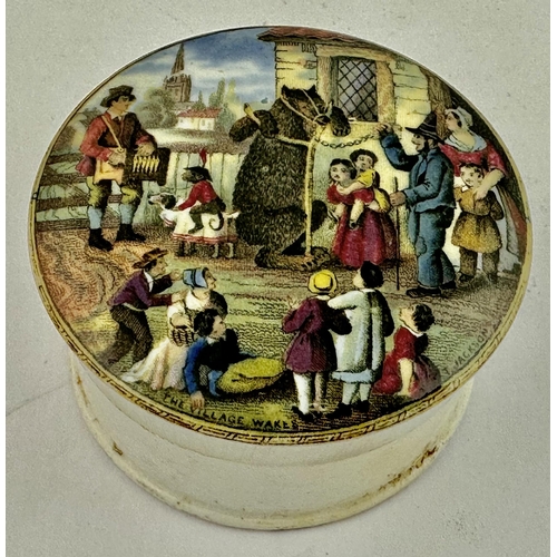 17 - THE VILLAGE WAKES POT LID. (KM pg 141 321a). Bright multicoloured transfer pot lid with base. A good... 