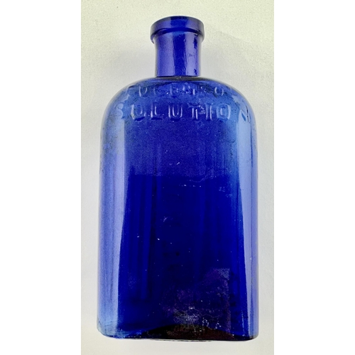 27 - UGENEOL POISON BOTTLE. 5.4ins tall. Cobalt blue, flattended rectangale shape with curved shoulders. ... 