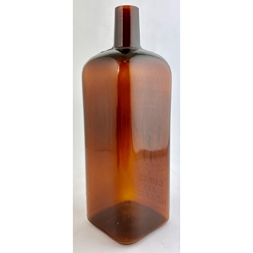 41 - RADAMS MICROBER KILLER BOTTLE. 11ins tall. Deep red-amber glass rectangular body, square base. Embos... 