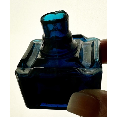 82 - TURQUIOSE SQUARE INK BOTTLE. 2.1 ins tall, 1.75ins squarebase. four nib like inserts around top, she... 