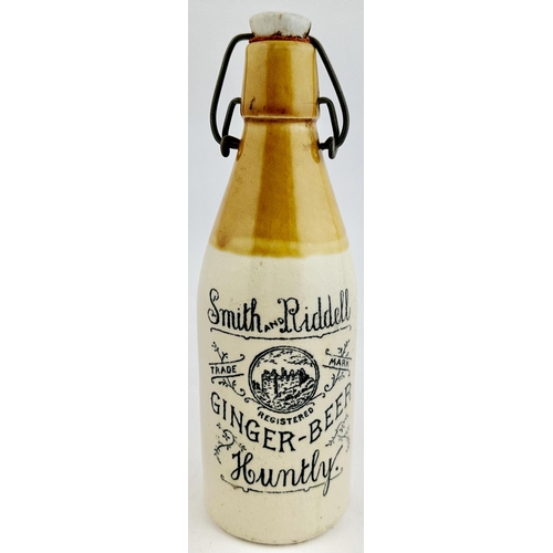 164 - SMITH & RIDDELL HUNTLEY GINGER BEER BOTTLE. 8.6ins tall. Ch., t.t., swing stopper - intact, worn. Wo... 