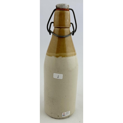 164 - SMITH & RIDDELL HUNTLEY GINGER BEER BOTTLE. 8.6ins tall. Ch., t.t., swing stopper - intact, worn. Wo... 