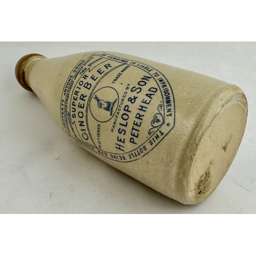 165 - HESLOP & SON PETERHEAD GINGER BEER BOTTLE. 8.1ins tall. Ch., tan blob, cork, lip, lower off white. A... 