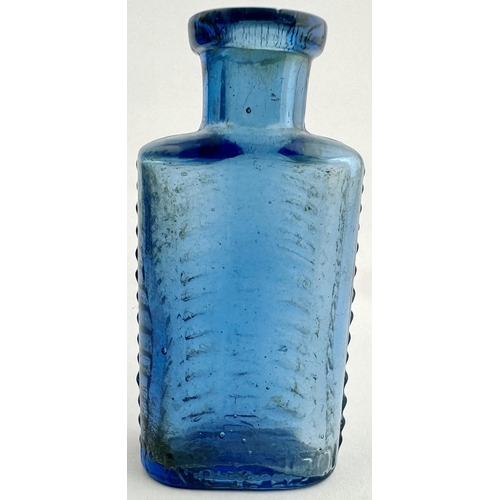 196 - FOULSTONS CRESCENT POISON BOTTLE. DP57 2.75ins tall. Crescent shape cross section. Mid cornflower bl... 