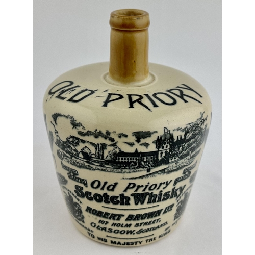 215 - OLD PRIORY SCOTCH WHISKY JUG. (WG p33) 7.3ins tall. Off white with light tan neck & handle. An extre... 