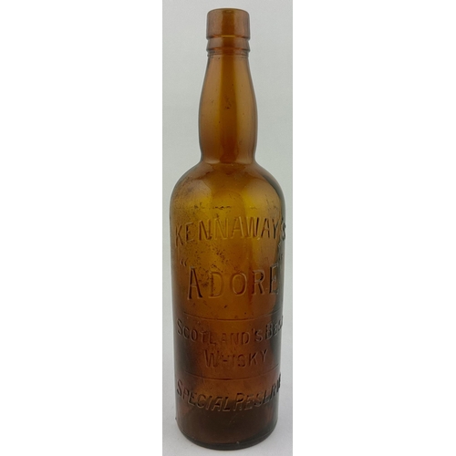 217 - KENNAWAYS ADORE SCOTCH WHISKY BOTTLE. 11.7ins tall. A deleightful vibrant brown glass tall whisky bo... 