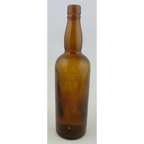 217 - KENNAWAYS ADORE SCOTCH WHISKY BOTTLE. 11.7ins tall. A deleightful vibrant brown glass tall whisky bo... 