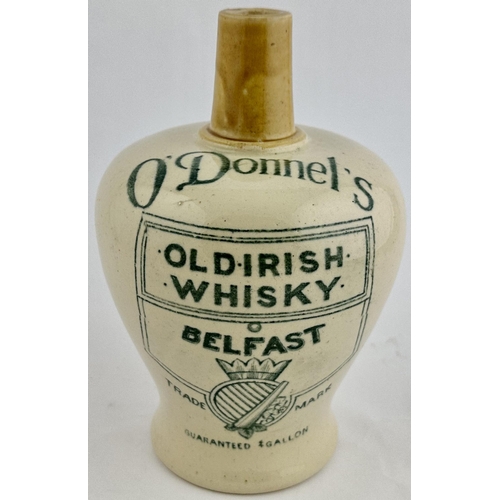 218 - ODONNELS BELFAST OLD IRISH WHISKY JUG. WG p144. 7.6ins tall. Off white body light tan neck & handle.... 