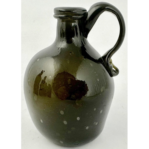 236 - ENGLISH FREEBLOWN HANDLED FLAGON BOTTLE. 4.8ins tall. Dense black/ dark green glass, globular form, ... 