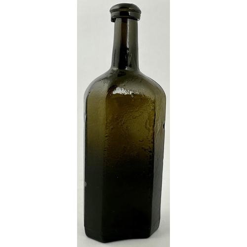 237 - ENGLISH FREEBLOWN UTILITY BOTTLE. 7.1ins tall. Dense black glass, rectangular base, facetted corners... 