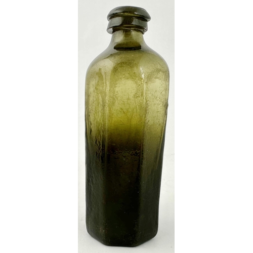 239 - ENGLISH FREE 2LOWN UTILITY BOTTLE. 5.25ins tall. Classic heavy black glass/ dark green octagonal med... 