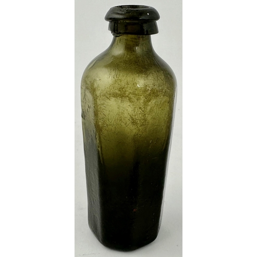 239 - ENGLISH FREE 2LOWN UTILITY BOTTLE. 5.25ins tall. Classic heavy black glass/ dark green octagonal med... 