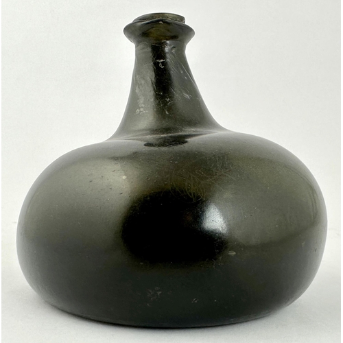 240 - ENGLISH BLACK GLASS ONION WINE BOTTLE. 5.1ins tall. Dense black glass classic c. 1705-1710 onion bot... 