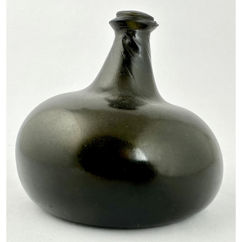 240 - ENGLISH BLACK GLASS ONION WINE BOTTLE. 5.1ins tall. Dense black glass classic c. 1705-1710 onion bot... 