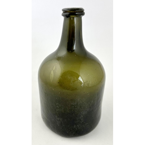 243 - ENGLISH BLACK GLASS MALLET WINE BOTTLE. 7.6ins tall. Black/ dark green English mallet. Re annealed l... 