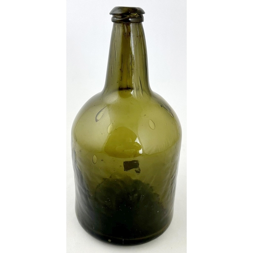 244 - ENGLISH BLACK GLASS MALLET WINE BOTTLE. 8.7ins tall. Dark green glass, wonderful large air bubbles e... 