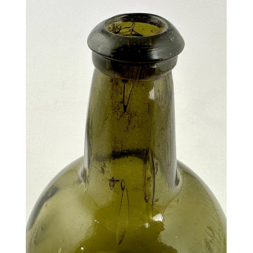 244 - ENGLISH BLACK GLASS MALLET WINE BOTTLE. 8.7ins tall. Dark green glass, wonderful large air bubbles e... 