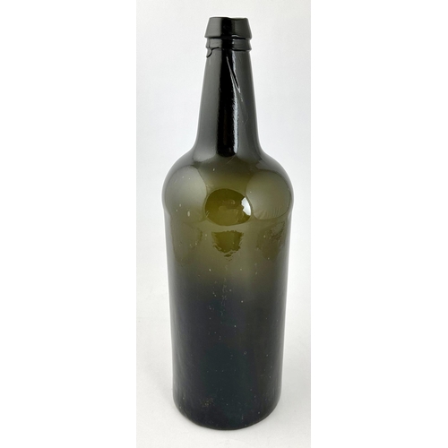 246 - LARGE ENGLISH BLACK GLASS CYLINDER WINE BOTTLE. 13.3ins tall. Dense black/ dark green glass, magnifi... 