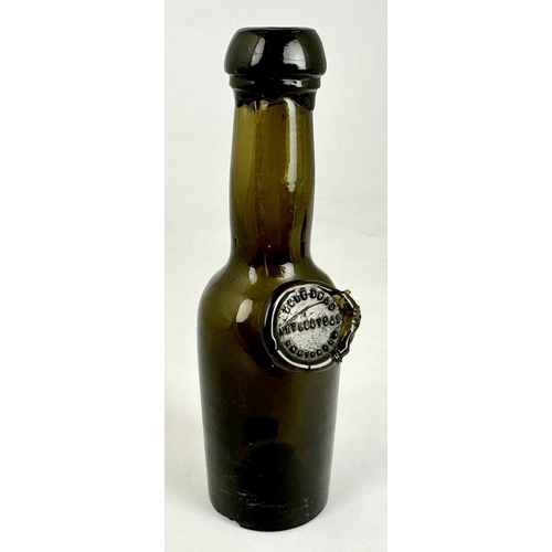 248 - MINIATURE BOLS SEALED WINE BOTTLE. 5.1ins tall. Bacl glass/ dark green. Cylinder form, slightly bulb... 