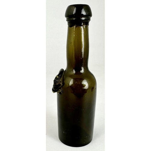 248 - MINIATURE BOLS SEALED WINE BOTTLE. 5.1ins tall. Bacl glass/ dark green. Cylinder form, slightly bulb... 