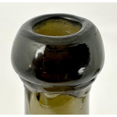 248 - MINIATURE BOLS SEALED WINE BOTTLE. 5.1ins tall. Bacl glass/ dark green. Cylinder form, slightly bulb... 