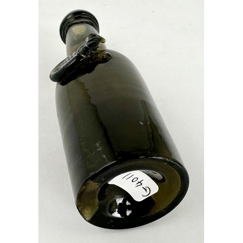 248 - MINIATURE BOLS SEALED WINE BOTTLE. 5.1ins tall. Bacl glass/ dark green. Cylinder form, slightly bulb... 