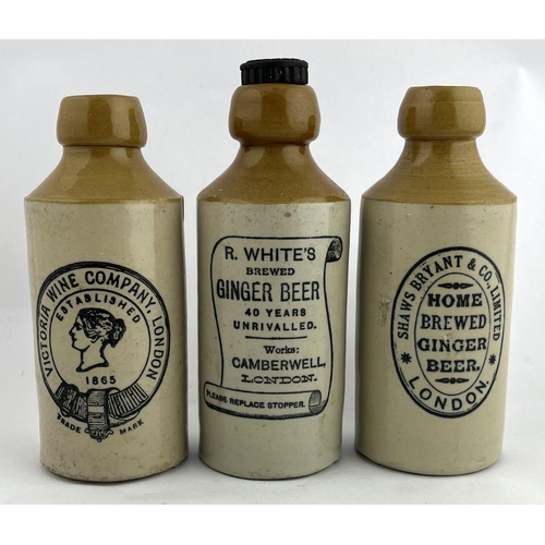 300 - LONDON GINGER BEER TRIO. Tallest 7.25ins. Inc. Victoria wine company, R. Whites & Shwas Bryant. Bour... 