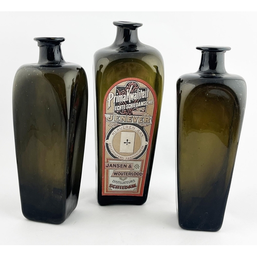 308 - GIN BOTTLE TRIO. Tallest 10.25ins. Olive green glass, base pontil, one with paper label. Minor damag... 