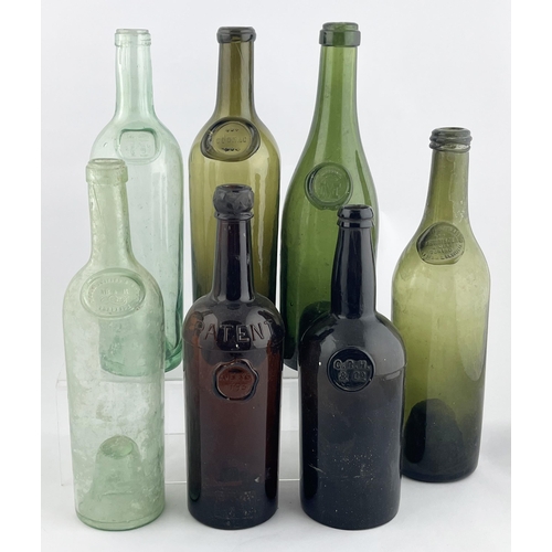 309 - SEALED WINES GROUP. Tallest 13ins. Various coloured glass Inc. Green, amber & aqua. A variety of sea... 