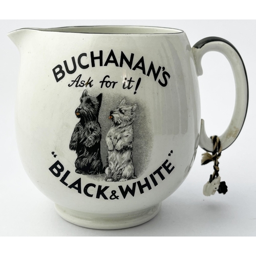 381 - BUCHANANS BLACK & WHITE PUB JUG. 5ins tall. Double sided, plastic dog charms to handle, reglued hand... 