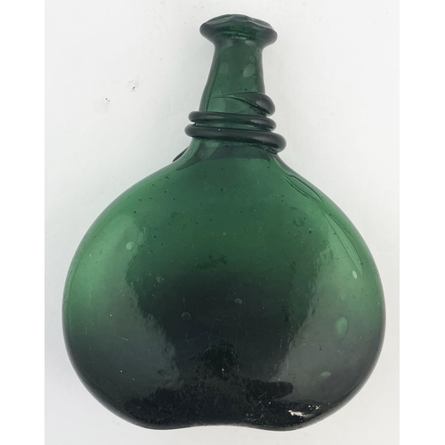 513 - BLADDER WINE BOTTLE. 8.5ins tall. Light olive green glass. Base pontil, base uneven. Body wear.