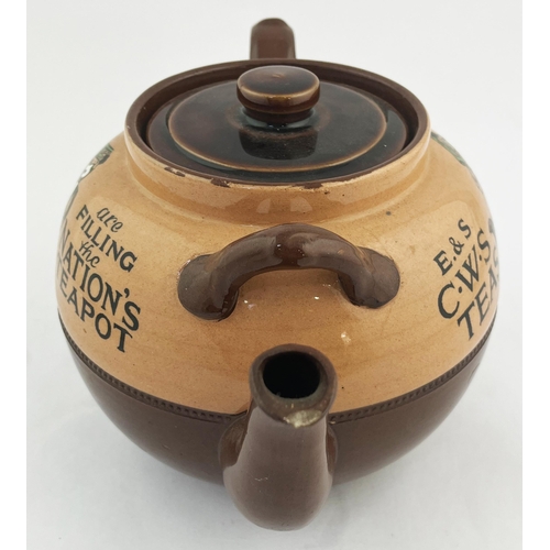 515 - CWS TEAS ADVERTISING TEAPOT. 6ins tall. Brown glaze, double sided, side handle & spout with lid. Cra... 