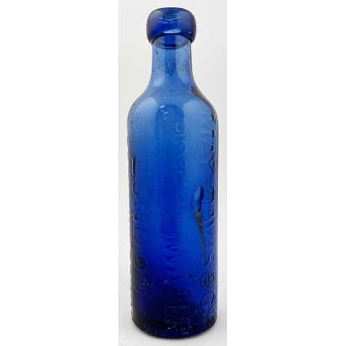 232 - LONDON UPRIGHT COBALT MAY DAVIS BOTTLE. 8.3ins tall. Bright cobalt upright cylinder. Vertically embo... 