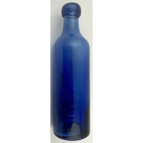 232 - LONDON UPRIGHT COBALT MAY DAVIS BOTTLE. 8.3ins tall. Bright cobalt upright cylinder. Vertically embo... 