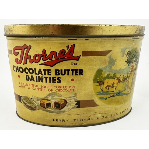 124 - THORNES CHOCOLATE BUTTER DAINTIES TIN. 8.8 x 4.9ins oval, 5.8ins tall. Dairymaid image & chocolates ... 