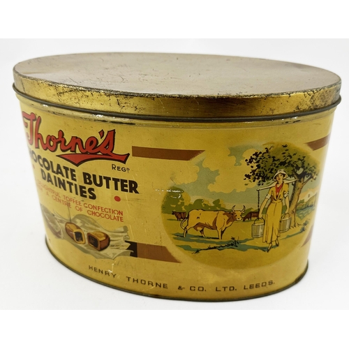 124 - THORNES CHOCOLATE BUTTER DAINTIES TIN. 8.8 x 4.9ins oval, 5.8ins tall. Dairymaid image & chocolates ... 