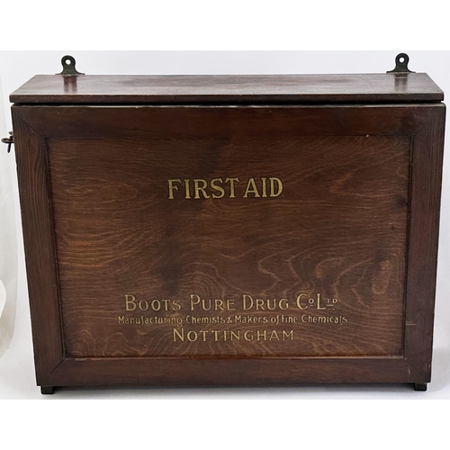 14 - BOOTS NOTTINGHAM WOODEN FIRST AID BOX . 19 x 14 x 5.5ins hinged front opening wall hung cabinet cont... 
