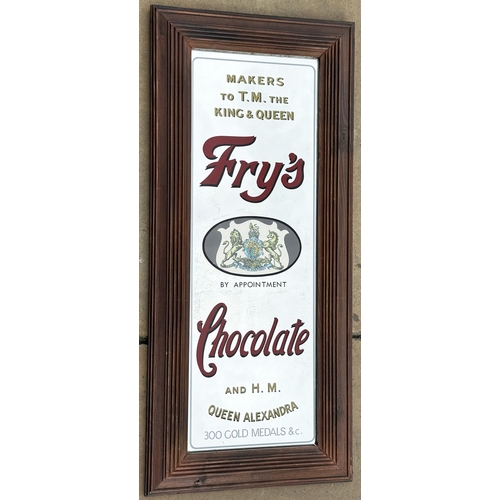 32 - FRYS CHOCOLATE FRAMED MIRROR. 32.6 x 14.4ins.Attractive wood framed mirror, not an early original it... 