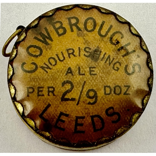 58 - LEEDS COWBROUGHS ADVERTISING WHISKY & ALE TAPE MEASURE. 1.4ins diam. E.Y.O. whisky one side, Nourish... 
